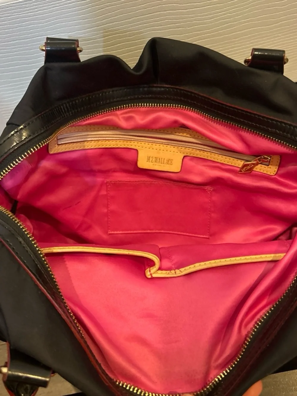 MZ Wallace Black Shoulder Bag with Gold and red Accents and pink interior